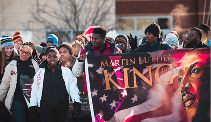 Students hold a banner of Martin Luther King Jr.